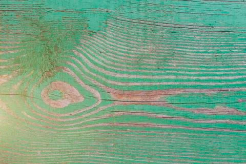 Old filthy pine board with cracks, covered dark green paint collapsed partly Stock Photos