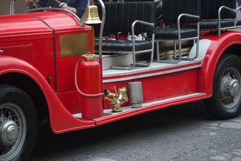 Old fire engine with bell and fire extinguisher Stock Photos