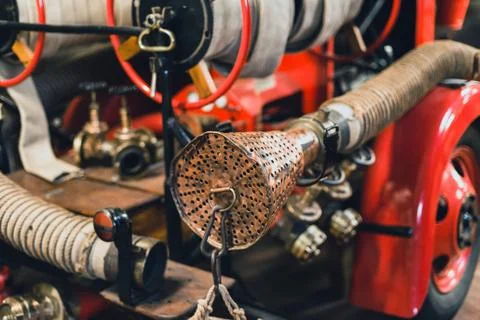 Old fire engine with fire hoses. Stock Photos