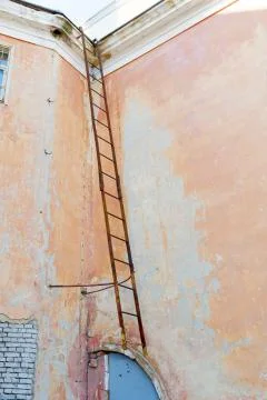 Old fire escape on a wall background Stock Photos