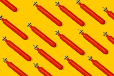 Old fire extinguisher on a yellow background Stock Photos