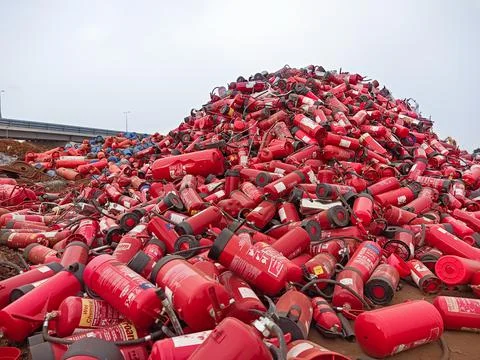 Old fire extinguishers are collected for recycling Stock Photos