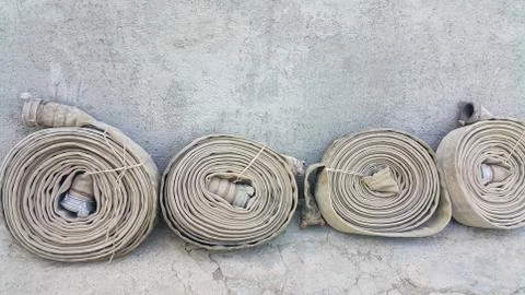 Old fire hoses close-up, including aluminum piping Stock Photos