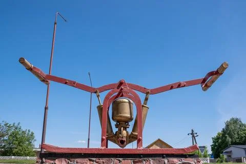 Old fire manual hydrant metallic red color against the blue sky Stock Photos