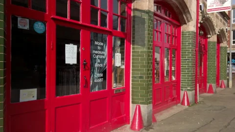 Old fire station now converted to shops and restaurants in Market Harborough. Stock Footage 172497612