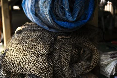 Old Fish Cage Net Rolled Up and Unused Stock Photos