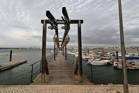 Old fish unloading pontoon-Arade River estuary-Calçada Portuguesa pavement. PT Stock Photos