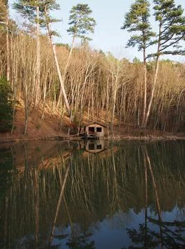 Old fishing hut at the lake Stock Photos