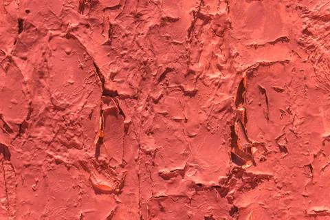 Old flaky paint peeling off on old wall, cracks and scrapes on the surface Stock Photos