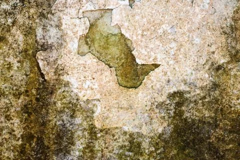 Old flaky white paint peeling off a grunge cracked wall Stock Photos