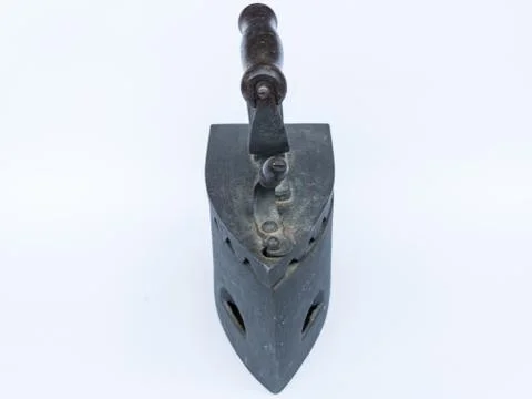 Old flatiron on white background Stock Photos