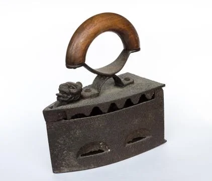 Old flatiron on white background Stock Photos