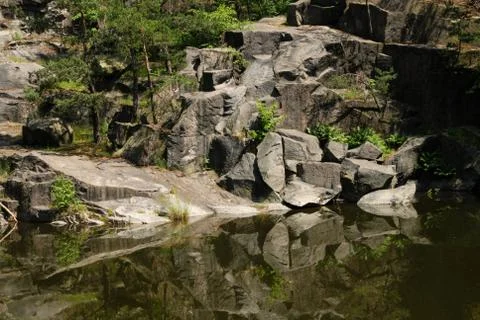 Old flooded quarry Stock Photos