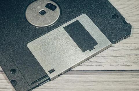Old floppy disk close-up. There is a part of the floppy disk in the frame. The Stock Photos