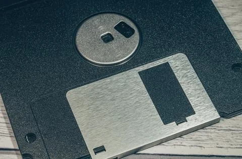 Old floppy disk close-up. There is a part of the floppy disk in the frame. The Stock Photos