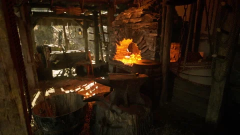 Old forge interior with glowing fire and tools reflecting warm light Stock Footage 331420552