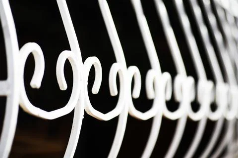 Old forged gate. fragment of the pattern of metal. rusty metal. Metal grill.. Stock Photos