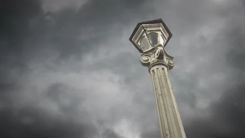 Old forging lamppost with dramatic clouds at background. Timelapse concept Vídeo Stock 130037184