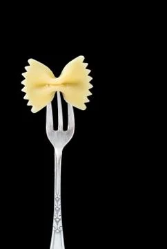 Old fork with farfalle Stock Photos