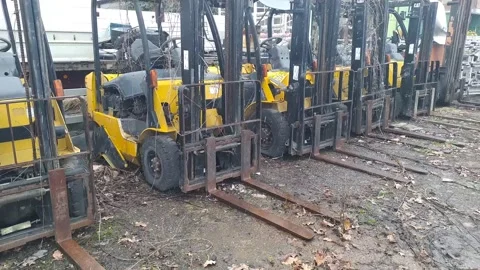 Old forklifts on junk yard Stock Footage 171412750
