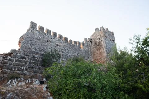 Old fortress wall, watchtower. Bottom view. Ruins Stock Photos