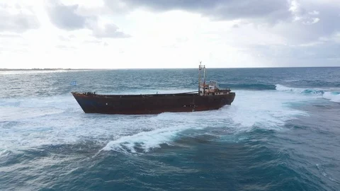 Old foundered ship on a shoal Stock-Footage 125956711
