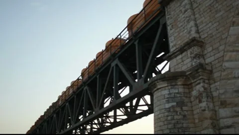 Old freight train on an old bridge Stock Footage 10585235