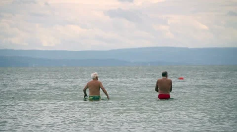 Old friends by the seaside on a cludy day Stock Footage 47175901