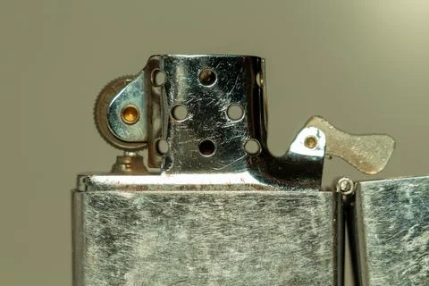 Old fuel accessory for lighting cigarettes showing signs of age and use Stockfoto's