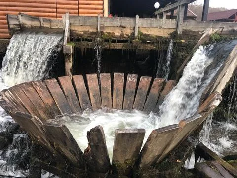 Old function water mill close up. Stock Photos