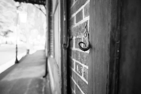 Old but functioning shutter tieback in York, South Carolina Stock Photos