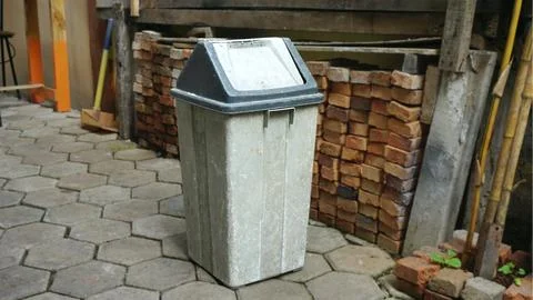 Old garbage cans in the yard Stock Photos
