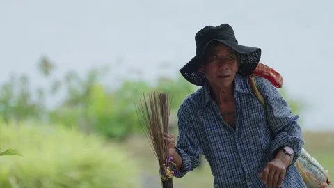 Old gardener walking on the hill Stock Footage 303365693