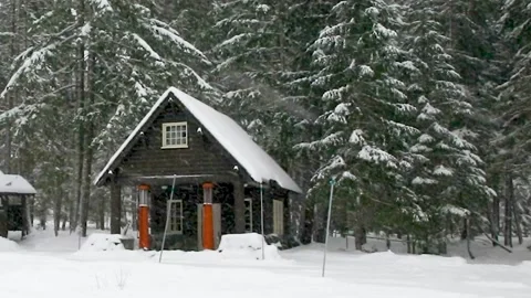 Old gas station on Mt Rainier at Longmire, Winter and snowing Stock Footage