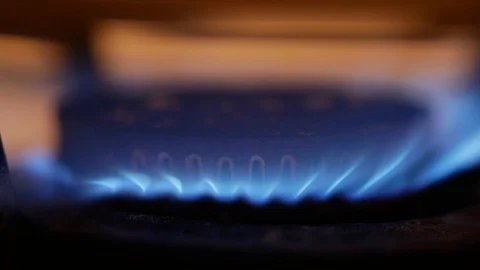Old gas stove burner blue flame detail Stock Footage 97669853