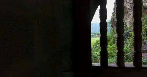 The old gate at Am Tien Cave, Tuyet Tinh Coc, a peaceful blue lake in the val Stock Footage 129194467