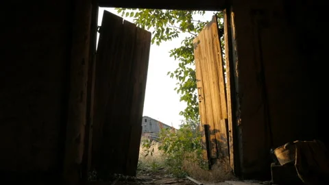 Old gate is closing. Dark room. Stock Footage 89988145