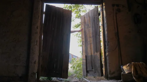 Old gate is opening. View from dark room Stock Footage 89988208