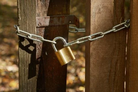 Old gate with padlock Stock Photos