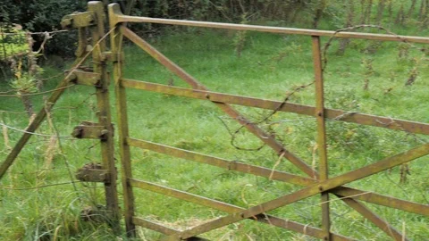 Old gate panning shot Stock Footage 116999360