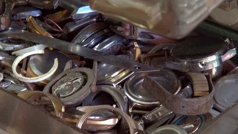 Old gears and vintage clock parts in watchmaker shop Stock Footage 77230802