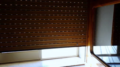 Old generation roller shutter, a shot from below Stock Footage 198714255