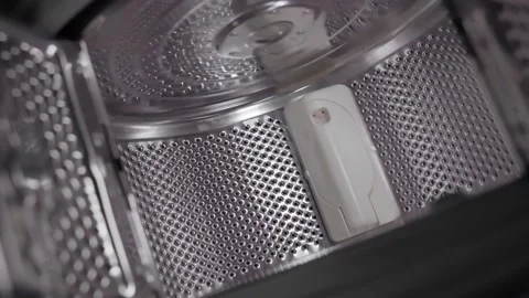 Old generation top-loading open drum washing machine. The camera flies out of Stock Footage 169693355