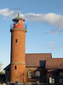 An old German-built lighthouse on the seashore in the Kaliningrad region  Stock Photos