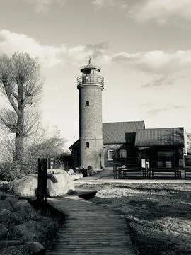 An old German-built lighthouse on the seashore in the Kaliningrad region Stock Photos