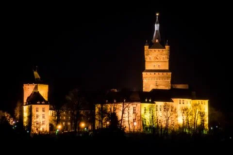 Old german castle tower clock palace at night Stock Photos