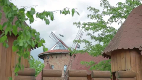 Old German mill among the trees .dynamic rotating blades. 스톡 동영상 156552463