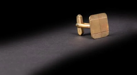 Old gilded cufflink Stock Photos