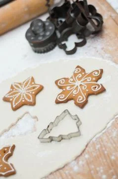 Old gingerbread maker baking sheet on wooden table with antiquities Stock Photos