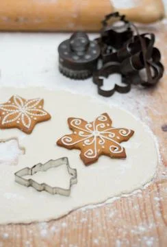 Old gingerbread maker baking sheet on wooden table with antiquities Stock Photos